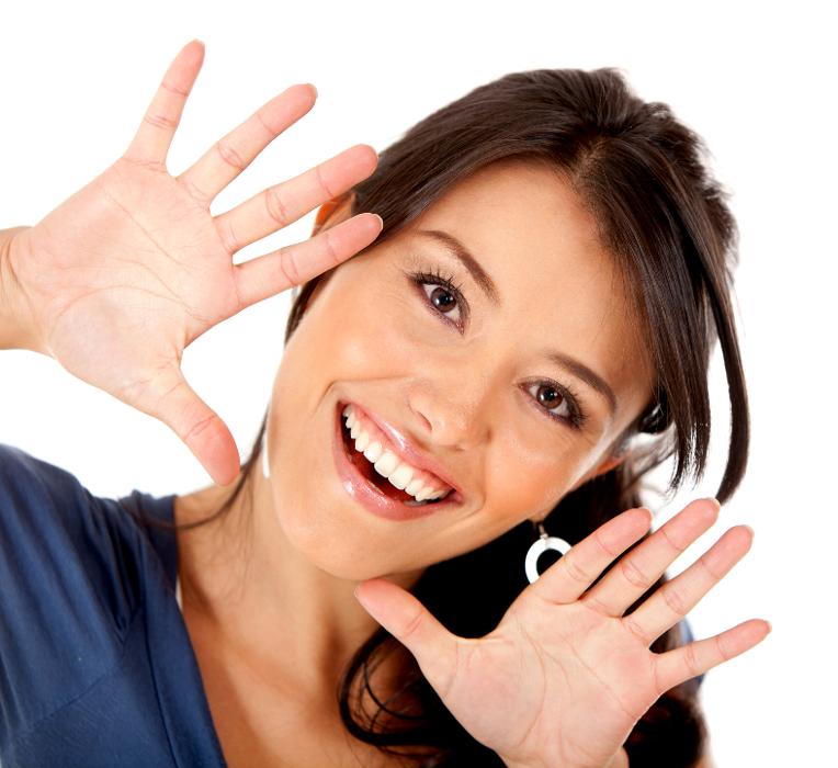 woman smiling with hybrid dentures in Champaign, IL