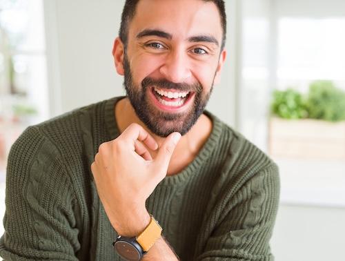 man smiling with snap-in dentures in champaign, IL