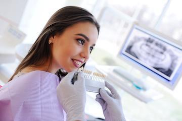Woman getting teeth whitened at cosmetic dentist in Champaign, IL