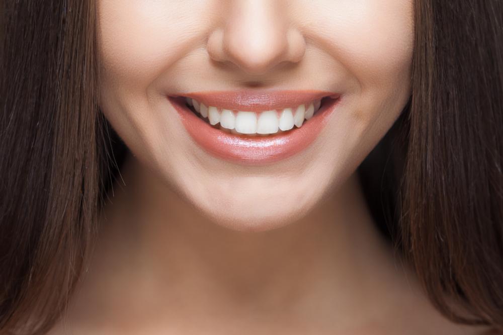 woman smiling with single dental implants in Champaign, IL