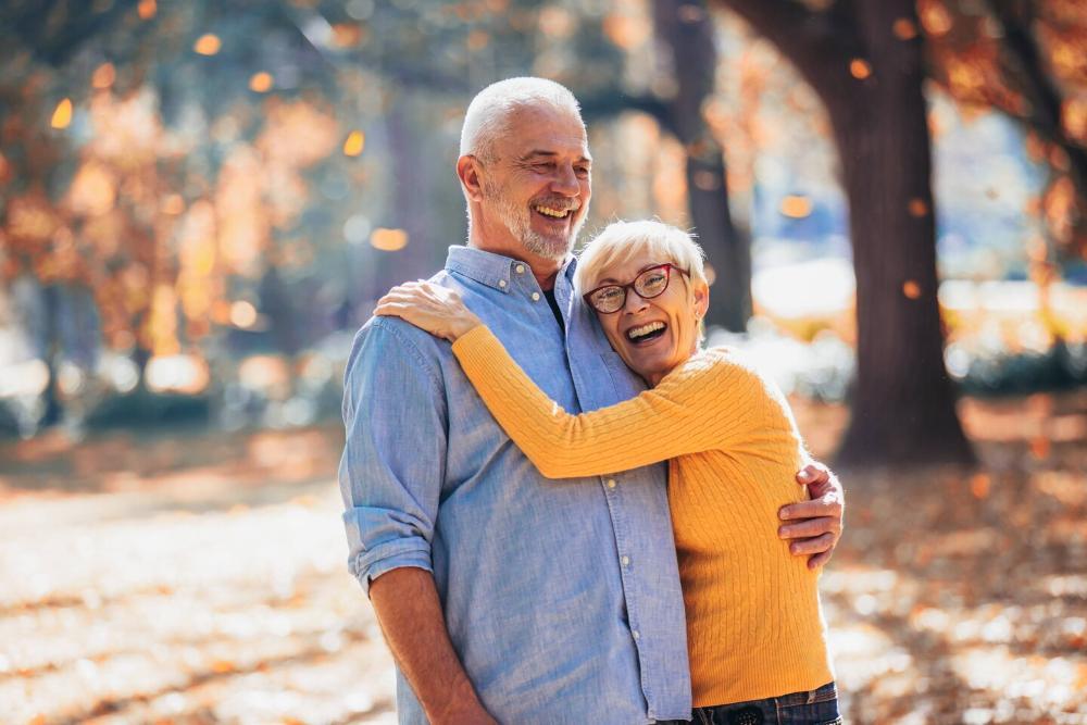 older man and woman smiling