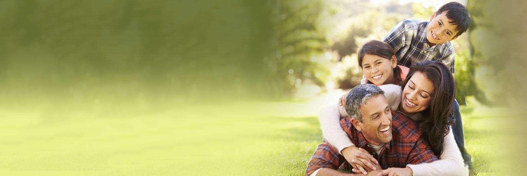 Family playing at Morrissey Park in Champagin, IL