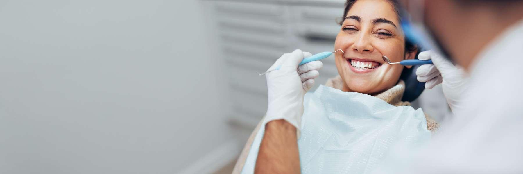 Patient in chair at cosmetic dentist for veneers in Champaign, IL