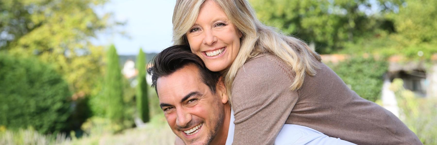 Man and wife smiling at Mattis Park in Champaign IL