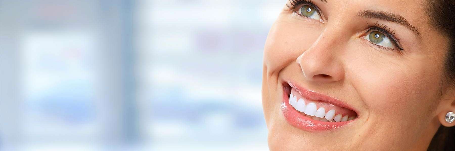Woman with dental crowns smiling in Champaign-Urbana