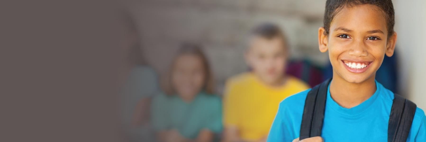 Children's dentistry patient smiling at school near Urbana IL