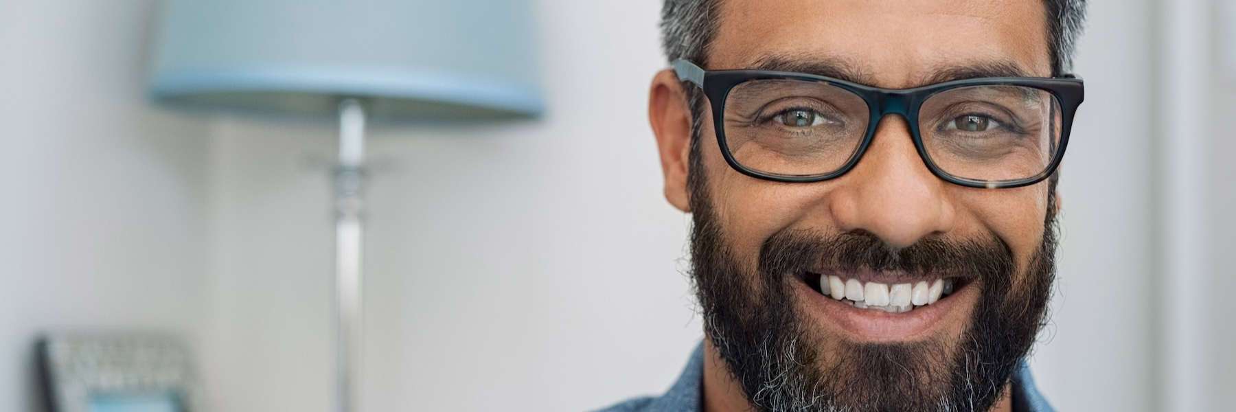 man smiling in Champaign after full smile reconstruction