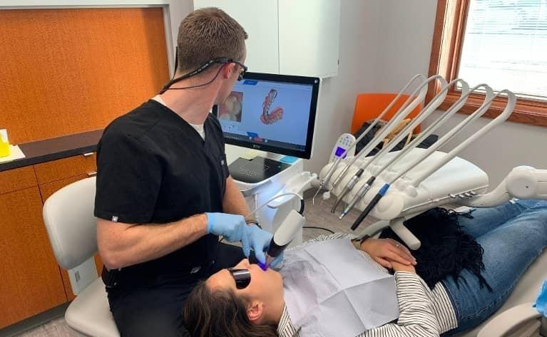 Patient Room Dr. John Anderson DDS performing dental exam and cleaning in Champaign, IL